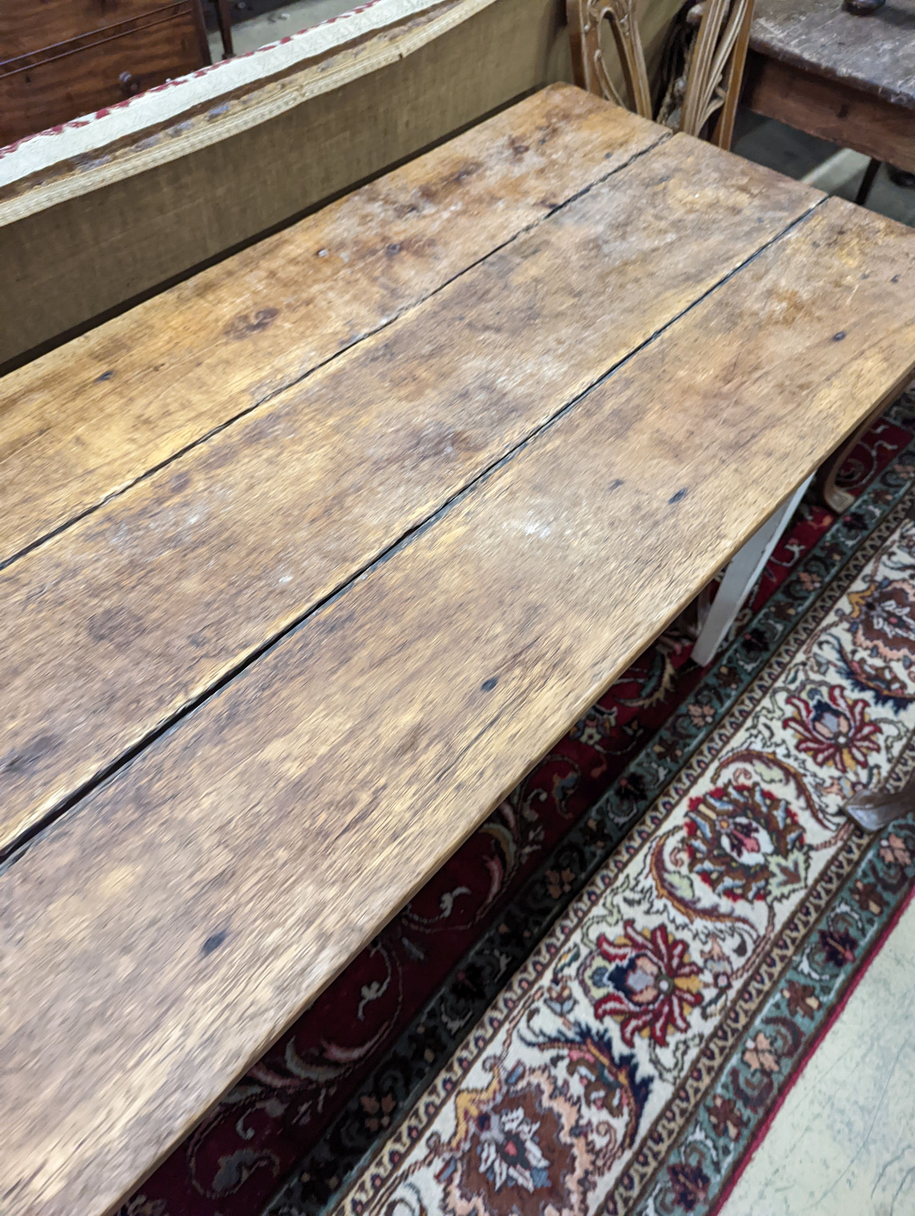 A 19th century French rectangular part painted fruitwood kitchen table. Length -214cm, Depth- 62cm, Height-76cm.